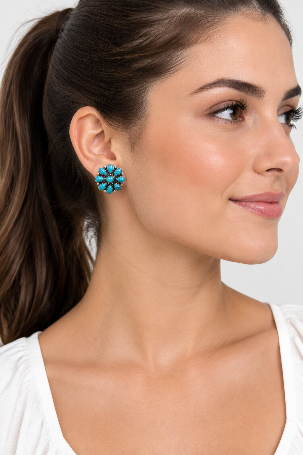 Pair of turquoise flower-shaped earrings. 'Sterling Silver'
